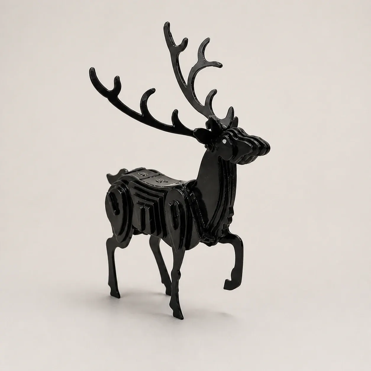 Studio visual of the black layered-metal stag object